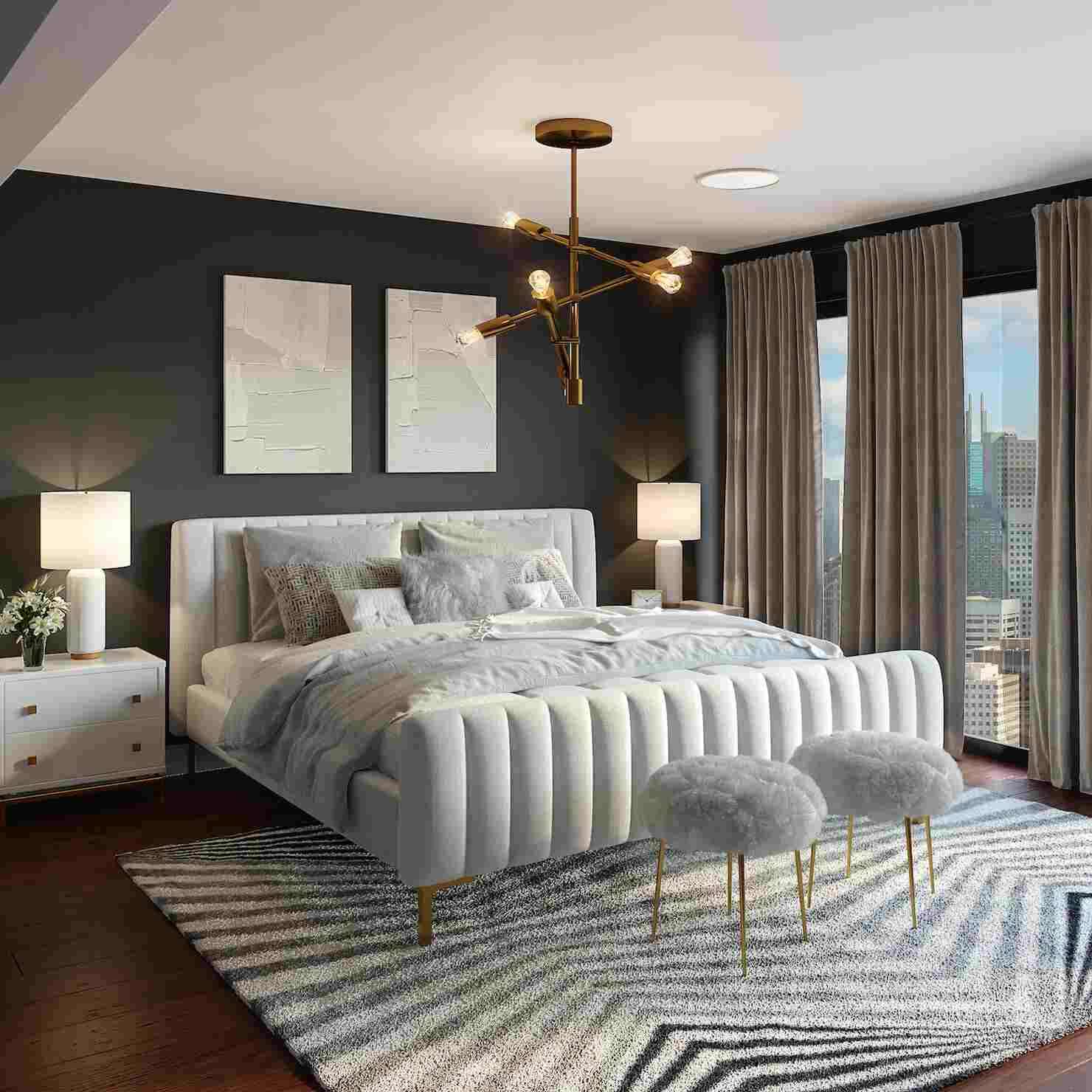 A stylish bedroom with black walls and white and gray bedding